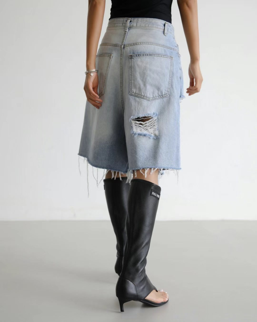 RIPPED KNEE LENGTH DENIM SHORTS